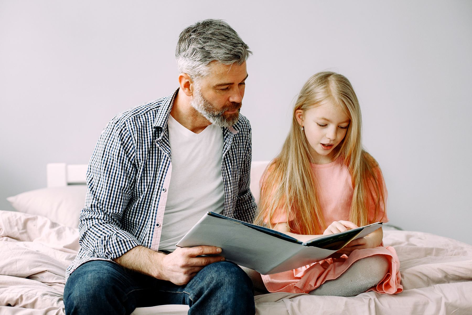 Parent and child working together on a learning activity at home
