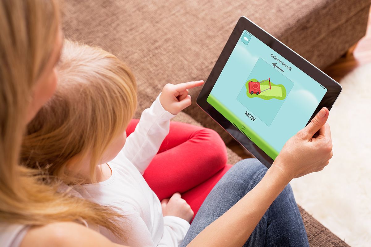 A parent and child practicing words together with the Speech Therapy for Apraxia app on a tablet